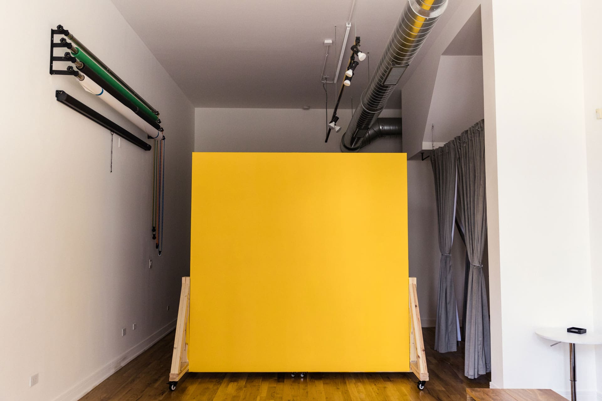 Yellow side of mobile wall available as backdrop option at Chicago photography studio P&M Studio