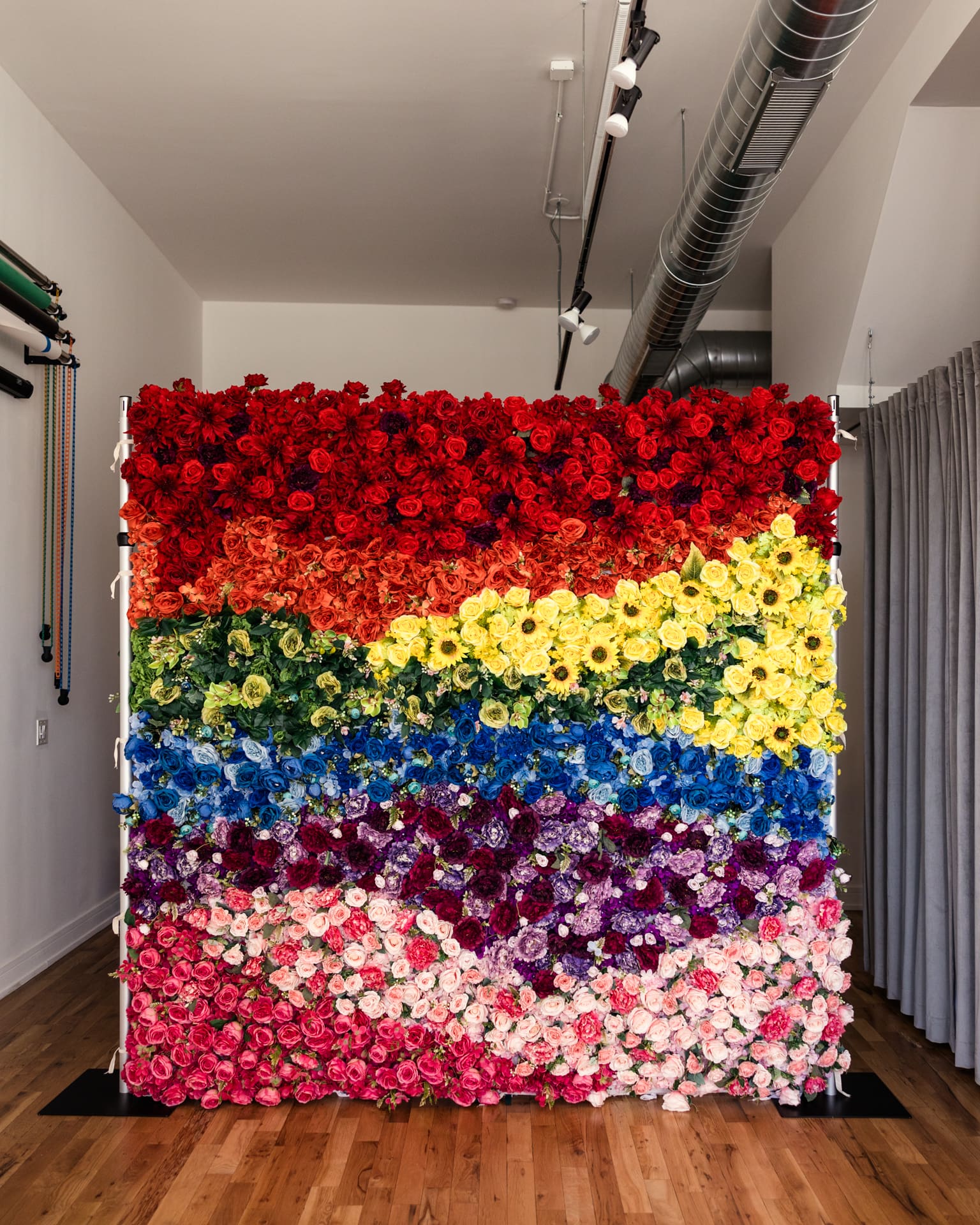 Custom rainbow flower wall set up in Chicago photography studio P&M Studio