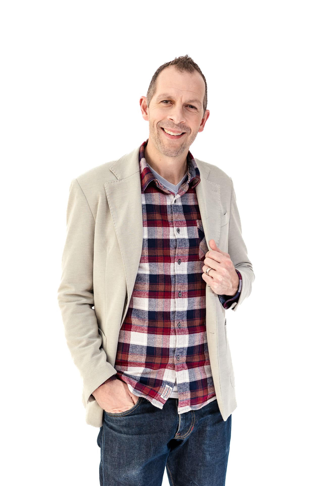 Headshot of man in cream colored jacket and plaid shirt at Chicago photography studio P&M Studio